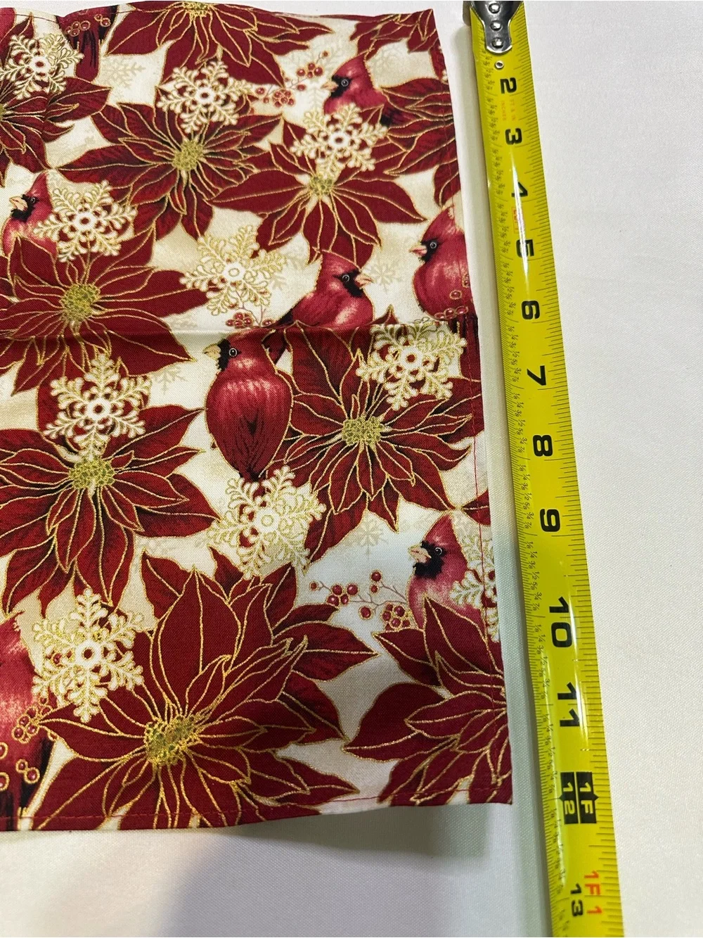 Poinsettia and cardinal apron, napkin, and table runner set